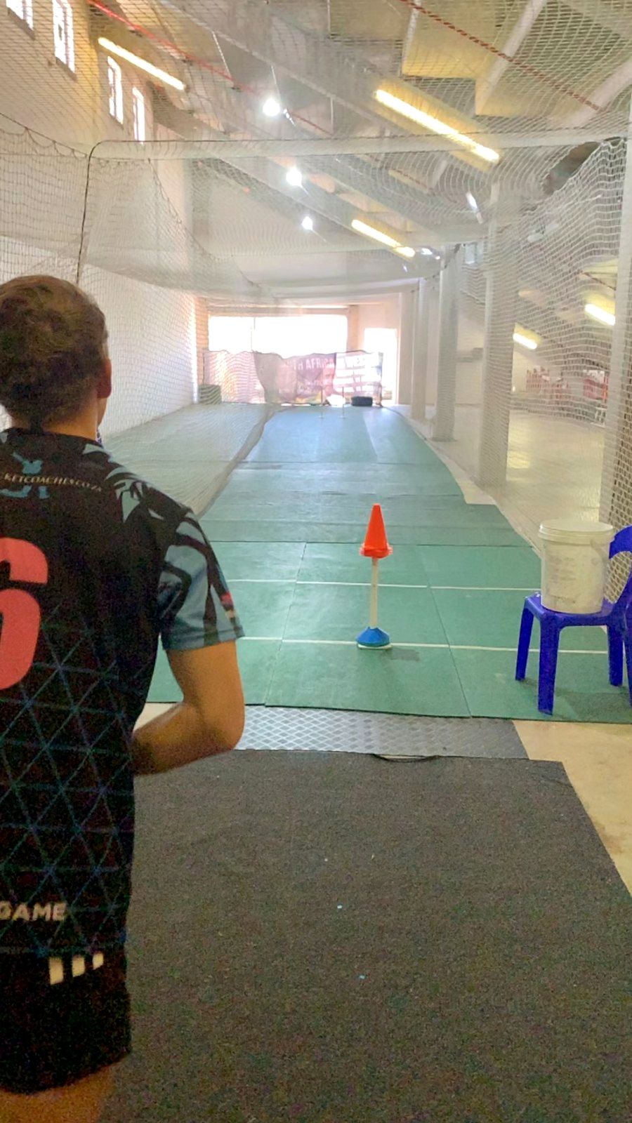 Daylight view down the indoor net lane